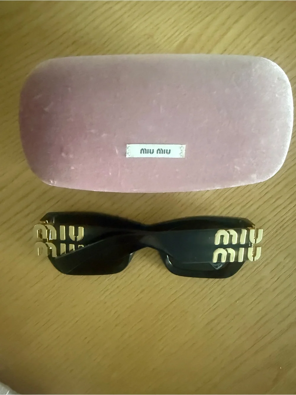 Miu Miu Black Sunglasses with Gold Logo Temples and Pink Velvet Case